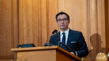 A man stands at the rostrum.