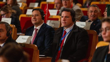 Several people listen to speeches in the former Second Chamber.