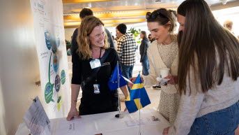 People and the swedish flag